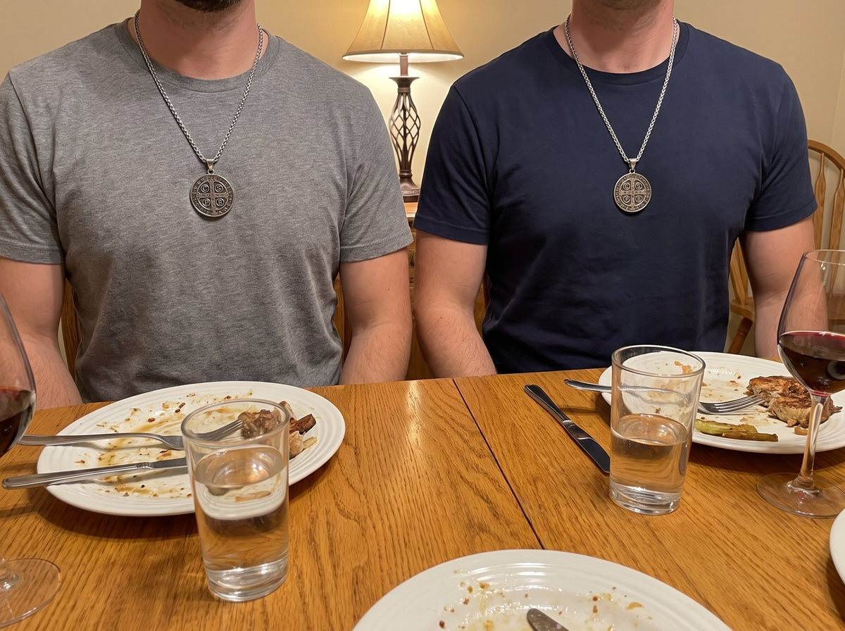 Two brothers at the dinner table, each wearing the St Benedict medal