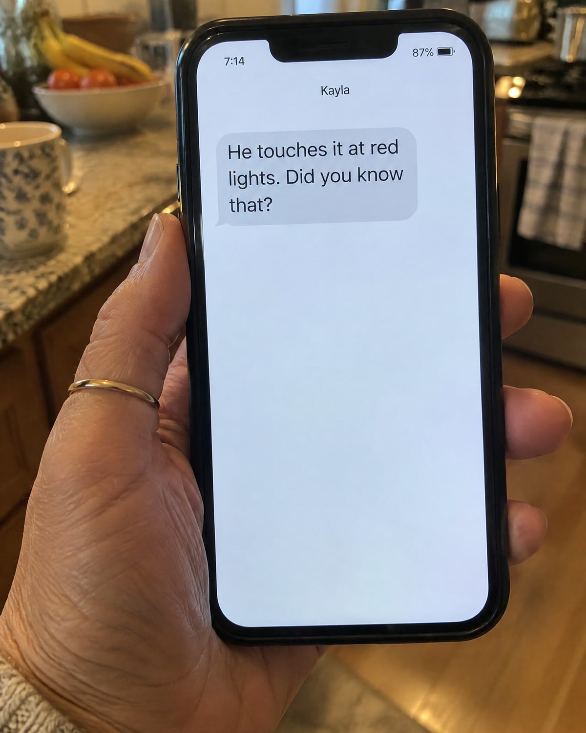 A text from Kayla: He touches it at red lights. Did you know that?