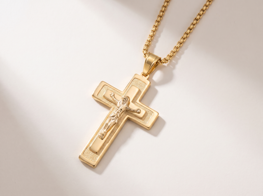 The gold crucifix on its chain